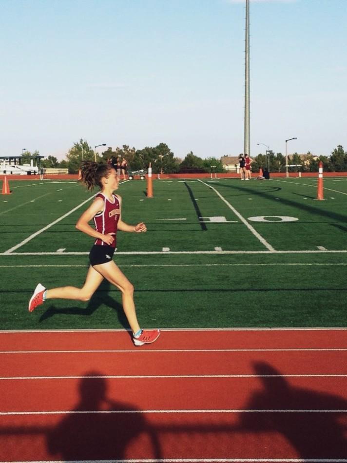 Hannah Pavlov running one of her races for the varsity track team 