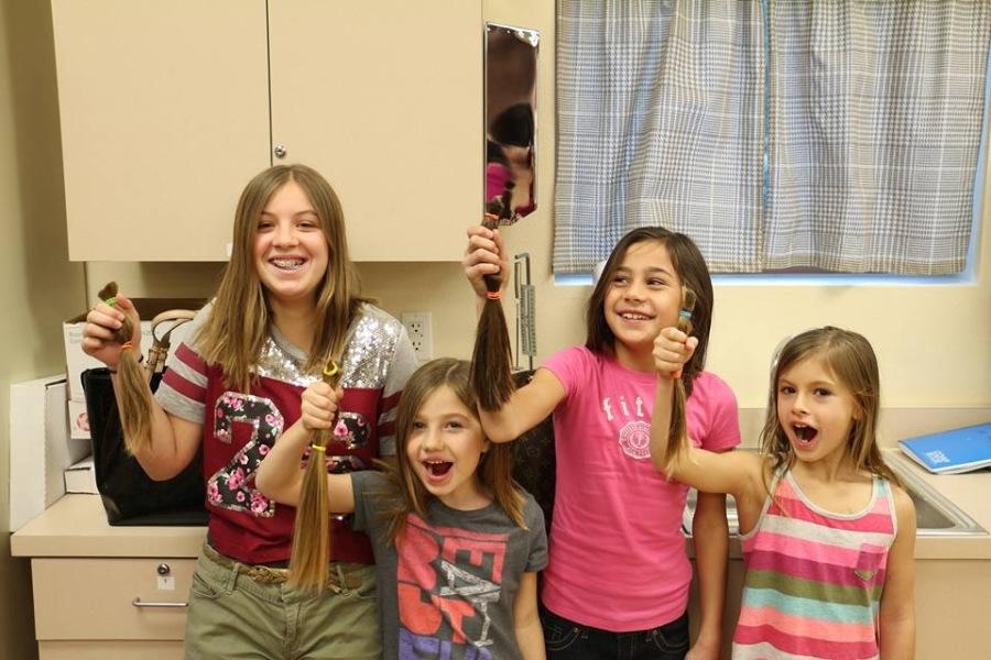 Faith Lutheran students showing their dedication to non-profit organization, Locks of Love.