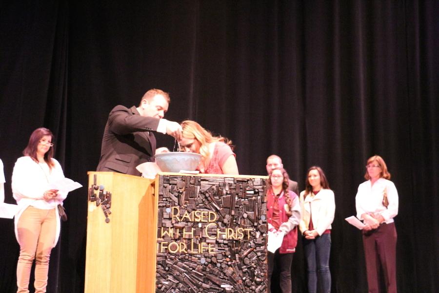 Krystal Peterson is baptized  during chapel. 