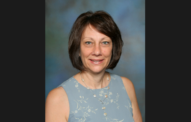 Photo caption: One of Mrs. Dunnings many yearbook pictures during her time teaching at Faith Lutheran. 
Photo by Bernhard and Williams Photography. 