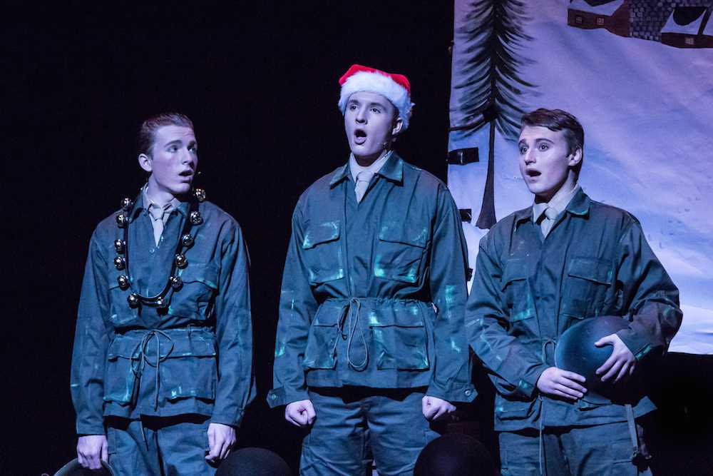 Photo caption: Christopher May (right) sings a Christmas tune in one of his favorite musicals