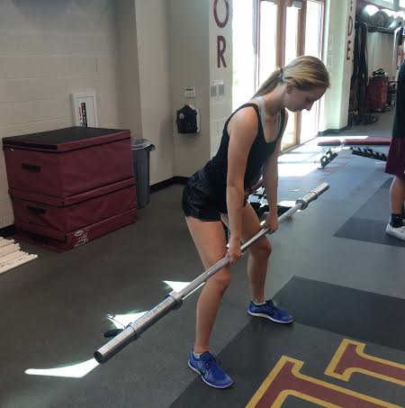 Athletes work hard in the weight room.