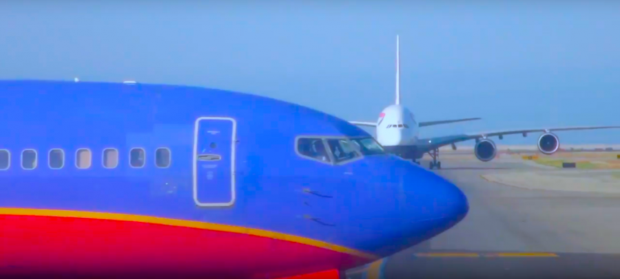 A Southwest Airlines Boeing 737 Crosses in front of a British Airways Airbus A380 at San Francisco International Airport.