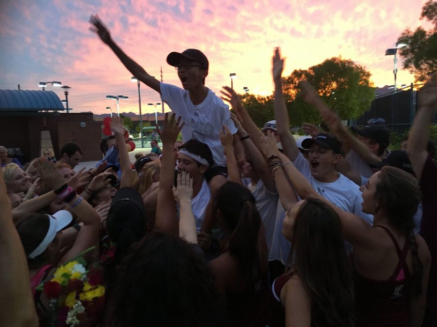 The tennis team celebrating their season at senior night