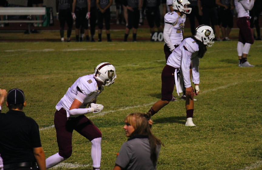 Joshua Hong (18) and Elijah Kothe (18) both prepare for an offensive play against Panther defense