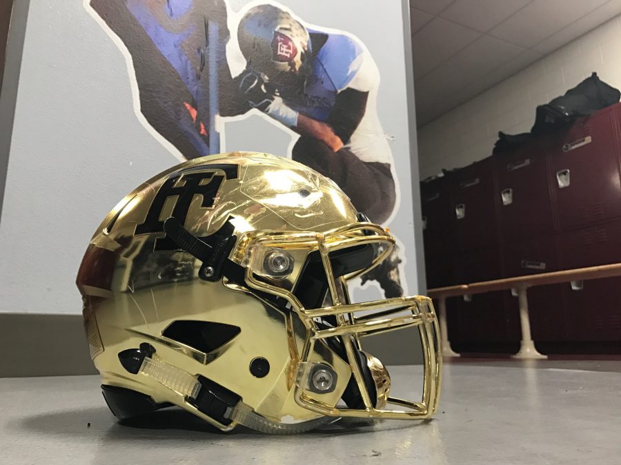 Photo caption: Faith Lutheran will wear new matte gold helmets as they hope to make history.