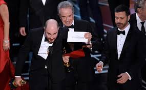 Photo caption: Producer of 'La La Land', Jordan Horowitz, holds up the correct envelope for the winner of Best Major Motion Picture, 'Moonlight'.