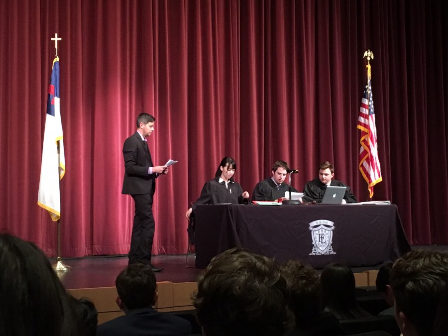 Mr. Watts discussing with Hart Roberts, Zac Anderson, and Jia Chen, the Three Justices about the bills that were passed in Model Congress.