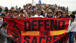 Photo caption: Native Americans fought against the pipeline building, since its on their own ground. Credit: billmoyers.com