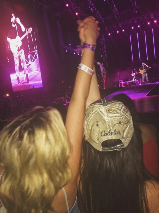 Delaney (left) and myself (right) front row for Sam Hunt's performance the night before tragedy struck the venue and city of Las Vegas. 