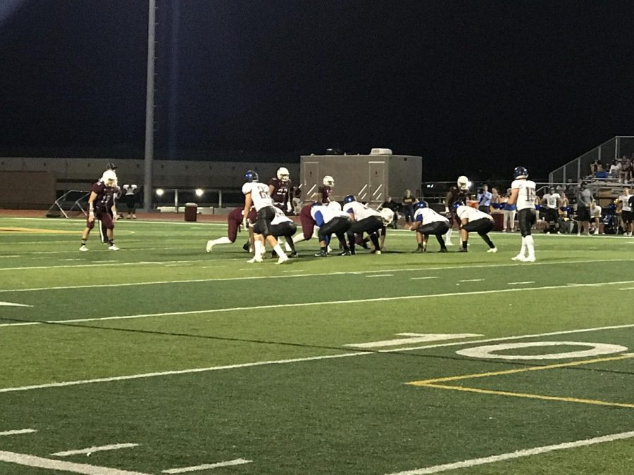 The Crusader defense lines up against the Eagle offense as they prepare to play another down. 