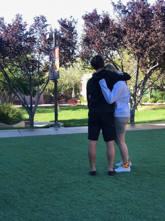 Two students embrace as they support each other one year after the Route 91 terror attack. 