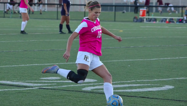Madison Stenslie shows off her strong stride as she warms up before Faith's big game. 