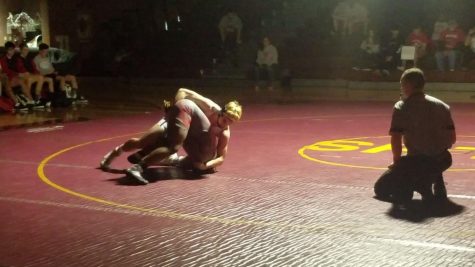 Connor Bourne, a 2x state champion and Greco Roman/ Cadet Freestyle All American, wrestling against Renaud Hunter in his match against Coronado. He would win by  fall in a minute and four seconds. 