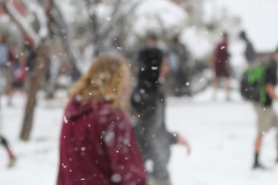 Students play in the snow during first block.