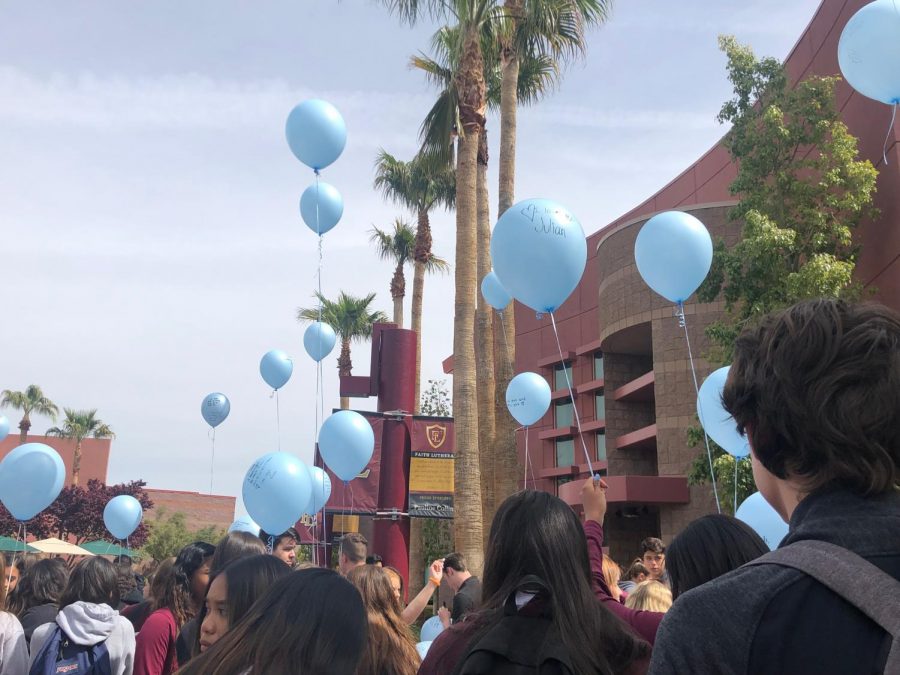 Friends of Julian write messages on balloons and released them April 8, 2018.