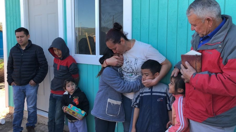 Family receiving the keys to their new house built by Faith Lutheran Students.