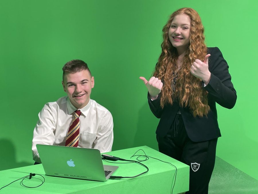 Addisen and Caden prepare the teleprompter for today's broadcast. 