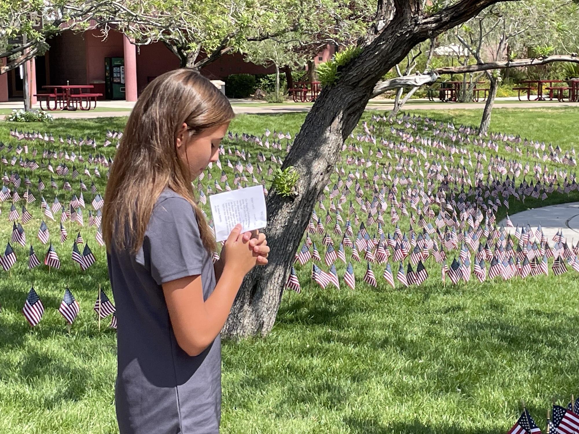 Students were given a prayer to read at the Faith Lutheran 9/11 Flag Memorial. Each prayer includes a victim who lost their life in 9/11 , and the students pray for their family. 