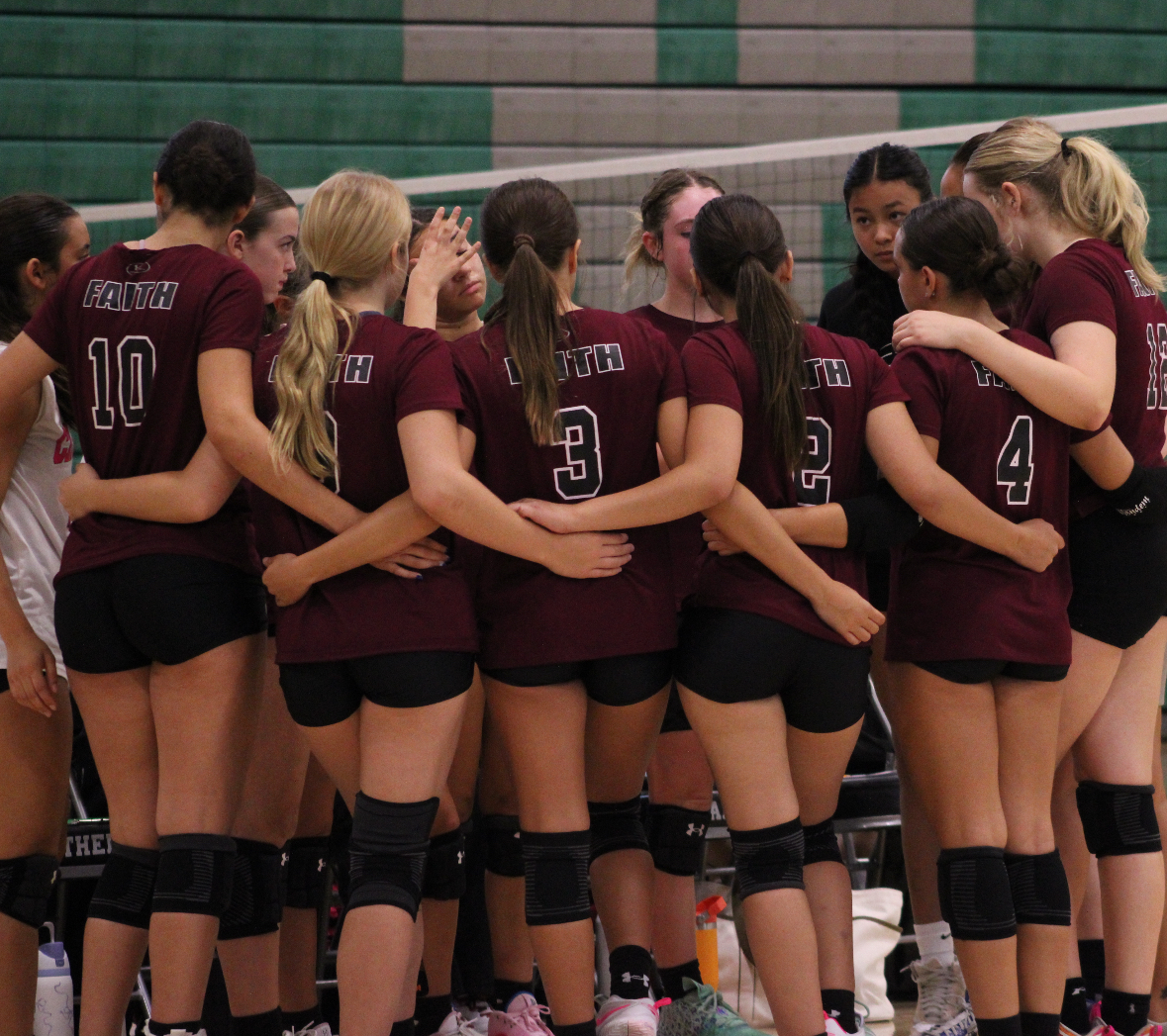 Faith Lutheran Junior Varsity Team in a huddle.