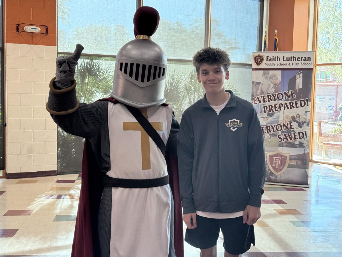 Crusader Lu and Welcome Cru ambassador Rex Gatten welcome in future families of Faith Lutheran.