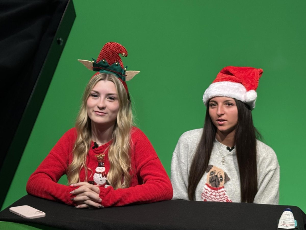 Makenna Judd and Victoria Rubbico preparing to go live for the annual Christmas broadcast.