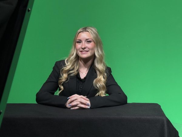 Senior Makenna Judd anchors at the news desk for this week's newscast.